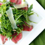 Delicate Carpaccio with Peppery Arugula: A Flavorful Duo