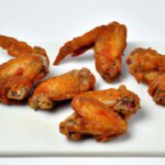 The Ultimate Guide to Chicken Wings: History, Flavors & Tips