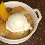 The Ultimate Peach Cobbler with Creamy Vanilla Ice Cream